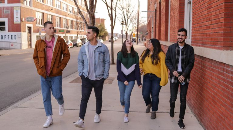 Group of students walking down a street