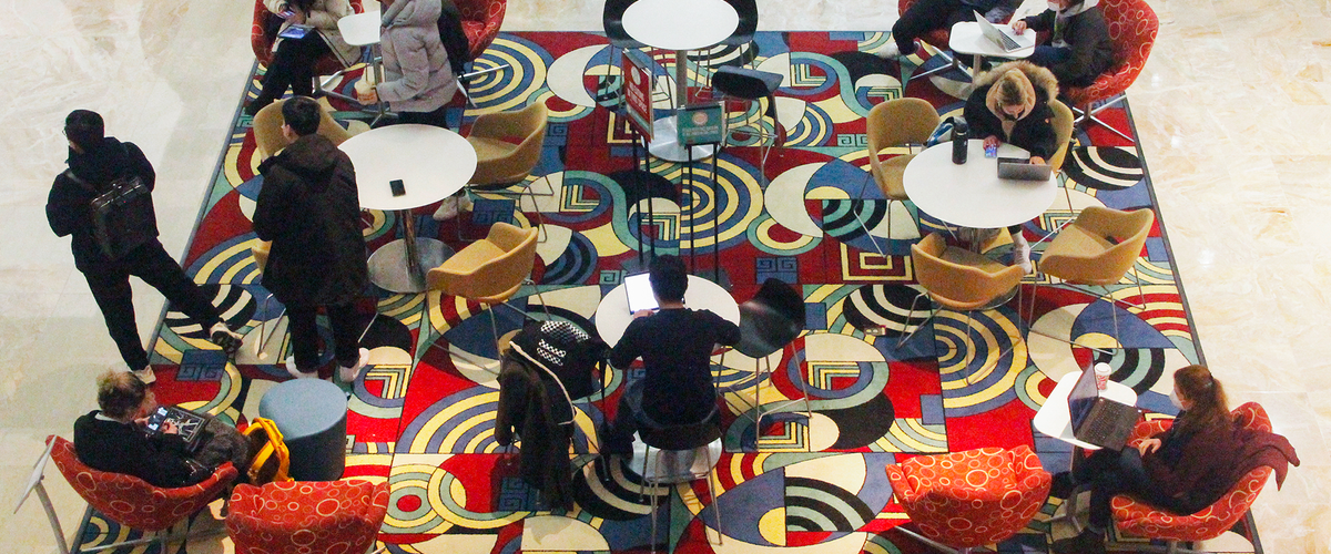Overhead photo off students in a lobby lounge