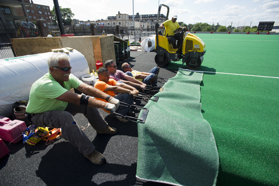 Laying astroturf, New Balance Field, Boston University