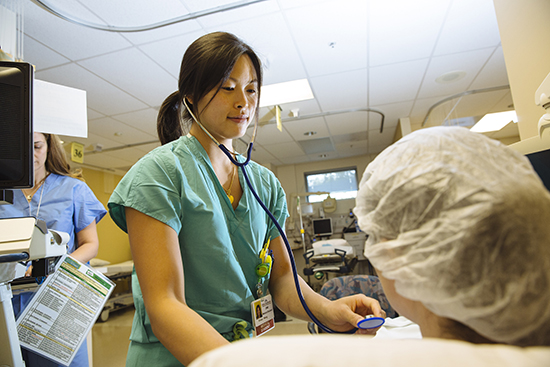 Medical student Vivian Wang with a patient at Kaiser Medical Center