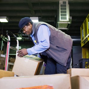 Lee Morris, who has worked at BU Dining Services for 55 years and who is about to receive an award from Aramak loads food supplies the GSU on September 22, 2015  Photo By Jackie Ricciardi for Boston University Photography