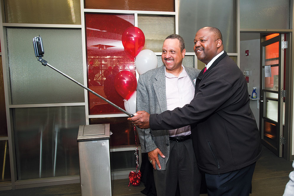 Albert James (ENG’85, Questrom’95) (left) and Terry Anthony (ENG’86) snap a selfie
