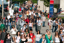 Students walk along Commonwealth Avenue on the Boston University Charles River Campus