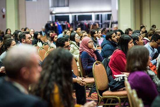 Students, faculty and staff watch a panel discussion on Donald Trump's Executive Order on Immigration during a Town Hall Meeting at Boston University