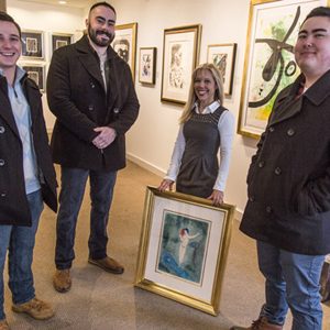 Susan Hirshberg poses with robbery thwarters Chris Savino, Mackenzie Thompson, and Jesse Doe
