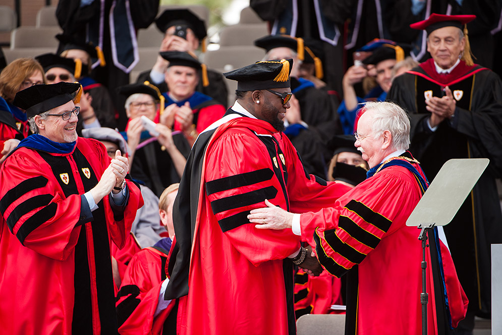 President Robert Brown presents former Red Sox player David Ortiz with an honorary Doctor of Human letters degree at the 2017 BU Commencement