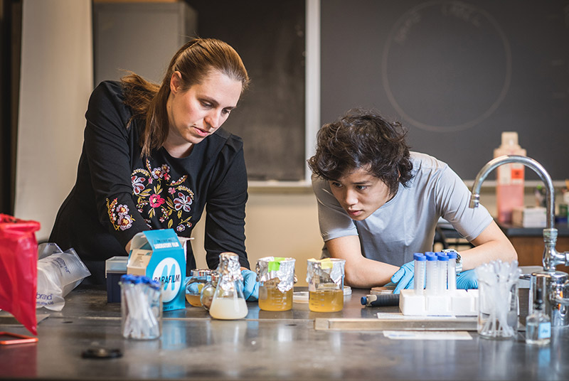 Boston University resesarchers Sandra Buerger and Alexander Smith in the lab researching what is in probiotics and do probiotics work