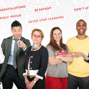 Boston University faculty and staff stand in front of words of advice for the graduating Class of 2018