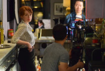 Lead actress Natalie Hebert gets into position during a shoot for The Bartender. In the background, Ran Shan (COM’ 18), prepares the scene. Photos by Kristian Lewis