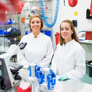 PhD Candidate Whitney Manhart and Research Technician Jennifer Pacheco pose for a photo at the Boston University National Emerging Infectious Diseases Laboratories (NEIDL). They are working with Dr. Elke Muhlberger on LLOV, a filovirus related to Ebola.