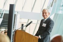 Boston University trustee Richard D. Cohen smiles as he speaks to a crowd at the Cohen Scholar Reception.