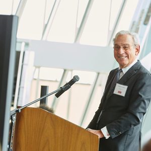 Boston University trustee Richard D. Cohen smiles as he speaks to a crowd at the Cohen Scholar Reception.