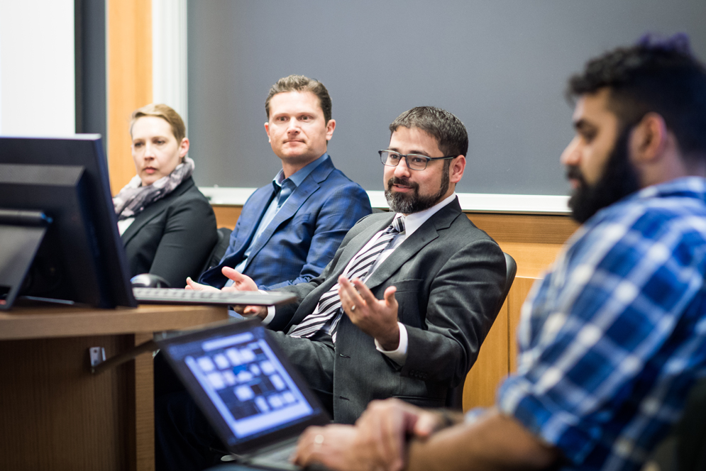 Imran Malek, a second year BU School of Law student, moderates an “Ask Us Anything” panel with the law firm Latham & Watkins