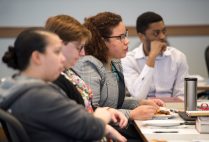 BU law students listening intently around a table