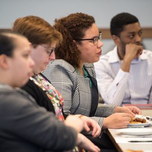BU law students listening intently around a table