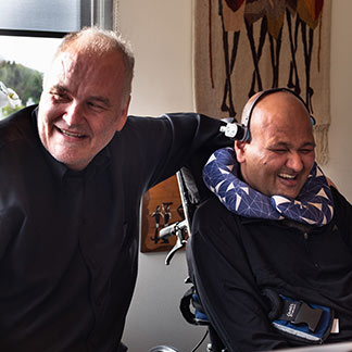 World-renowned neuroscientist Anders Dale laughs with Rahul Desikan at Desikan’s 40th birthday party.