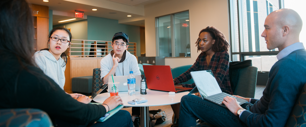 A group of students sitting around a table