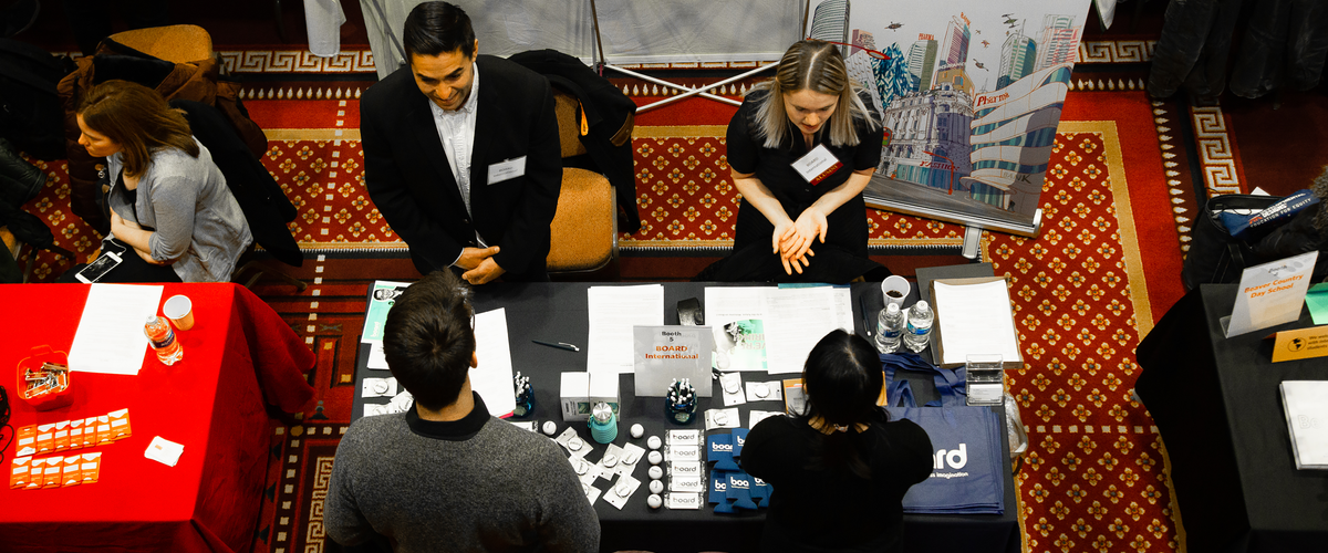 Students speaking with employers at the University-Wide Career Fair