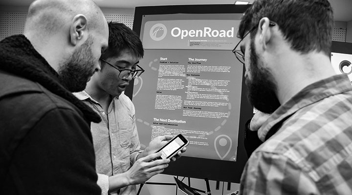 Jay Li (CFA/COM '21) explains his product to interested audience member during the SPARK expo at Boston University's BUild lab