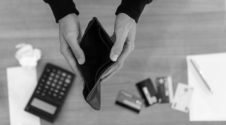 Man holding empty wallet