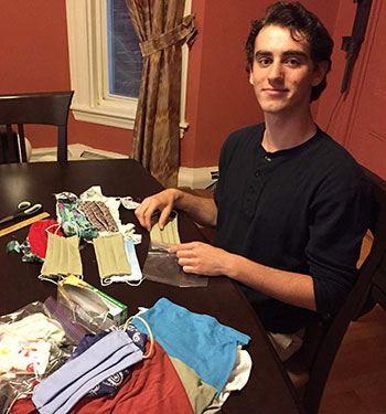Adam Katz preparing homemade masks for donation