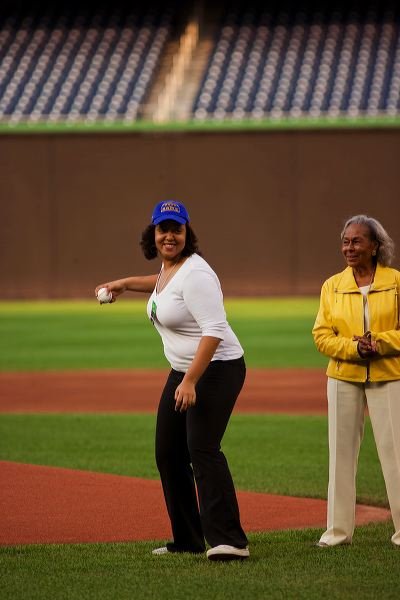 Carol Guerrero throwing first pitch