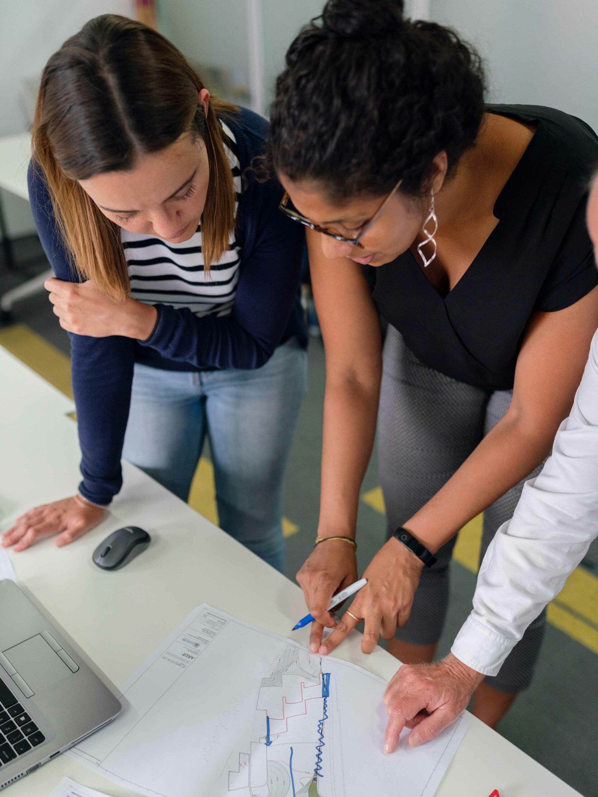 Photo of two students from above working together on an engineering project