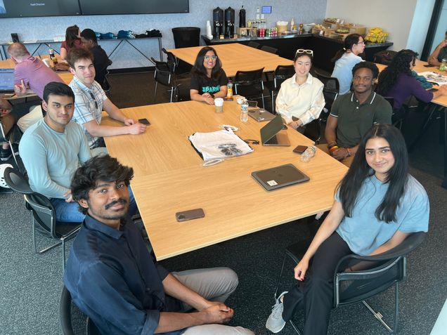 Photo of students collaborating around a table