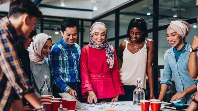 Photo of students collaborating around table