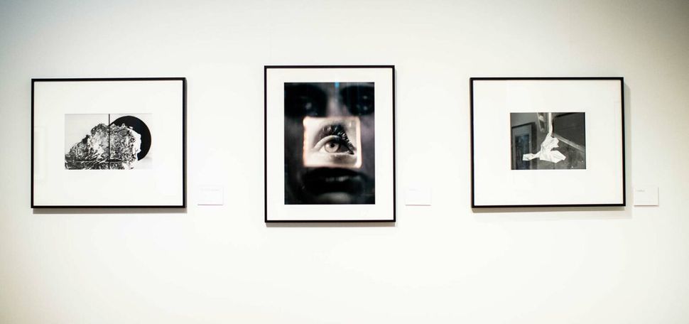 Photographs by artists Claire A. Warden (from left), Jordanna Kalman, and Elizabeth M. Claffey hang side by side in the Boston University Stone Gallery.
