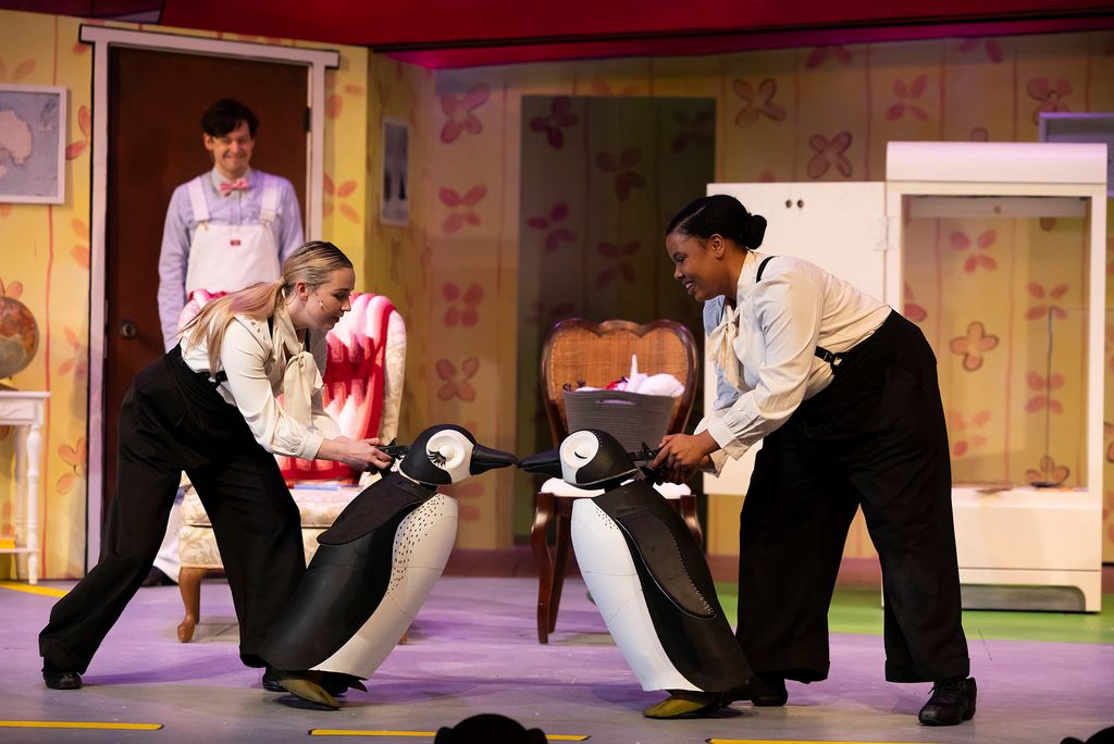 The penguin puppets are manipulated by the show’s actors. Lisa Kate Joyce (left) and Yasmeen Duncan bring their penguins to life as Michael Jennings Mahoney (Mr. Popper) looks on.