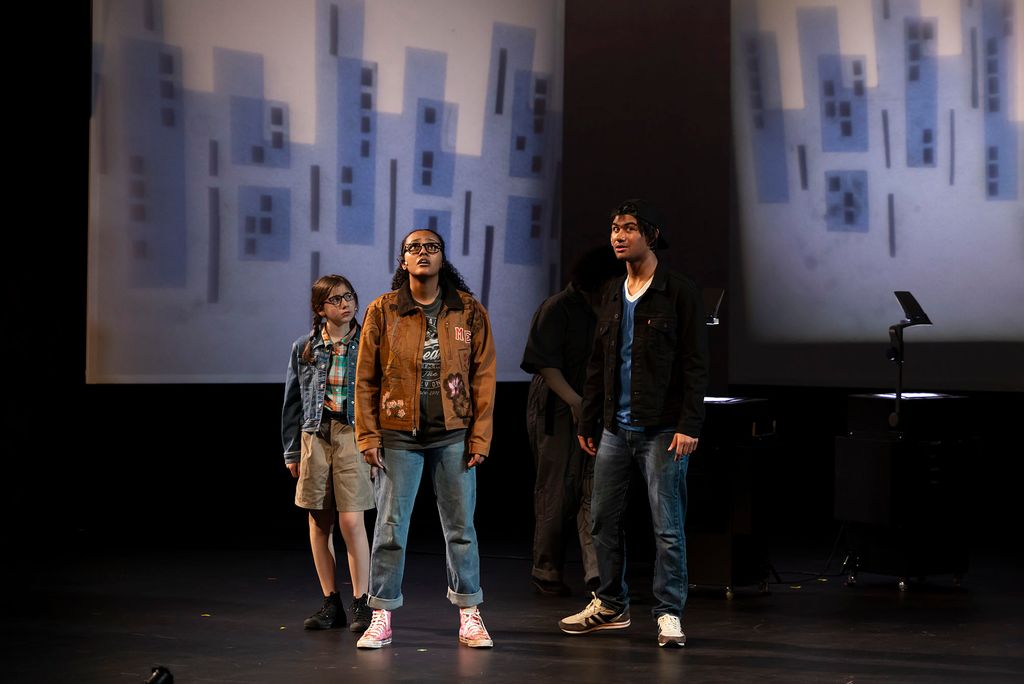 Eviva Rose (left) as Charles Wallace Murry, Beza Mekonnen as Meg Murry, and Miles Allen as Meg’s friend Calvin in a scene from Wheelock Family Theatre’s production of A Wrinkle In Time