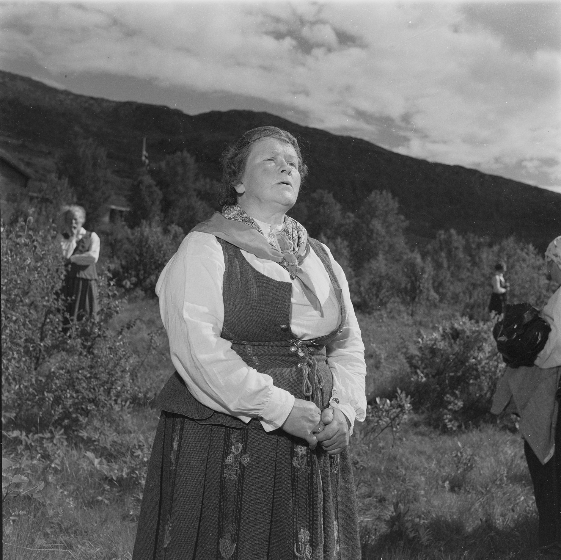 A woman calling livestock in Norway in 1952