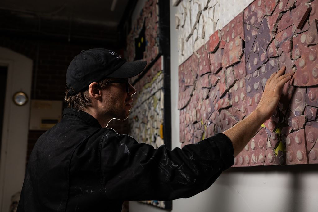 Artist S. Proski in their studio