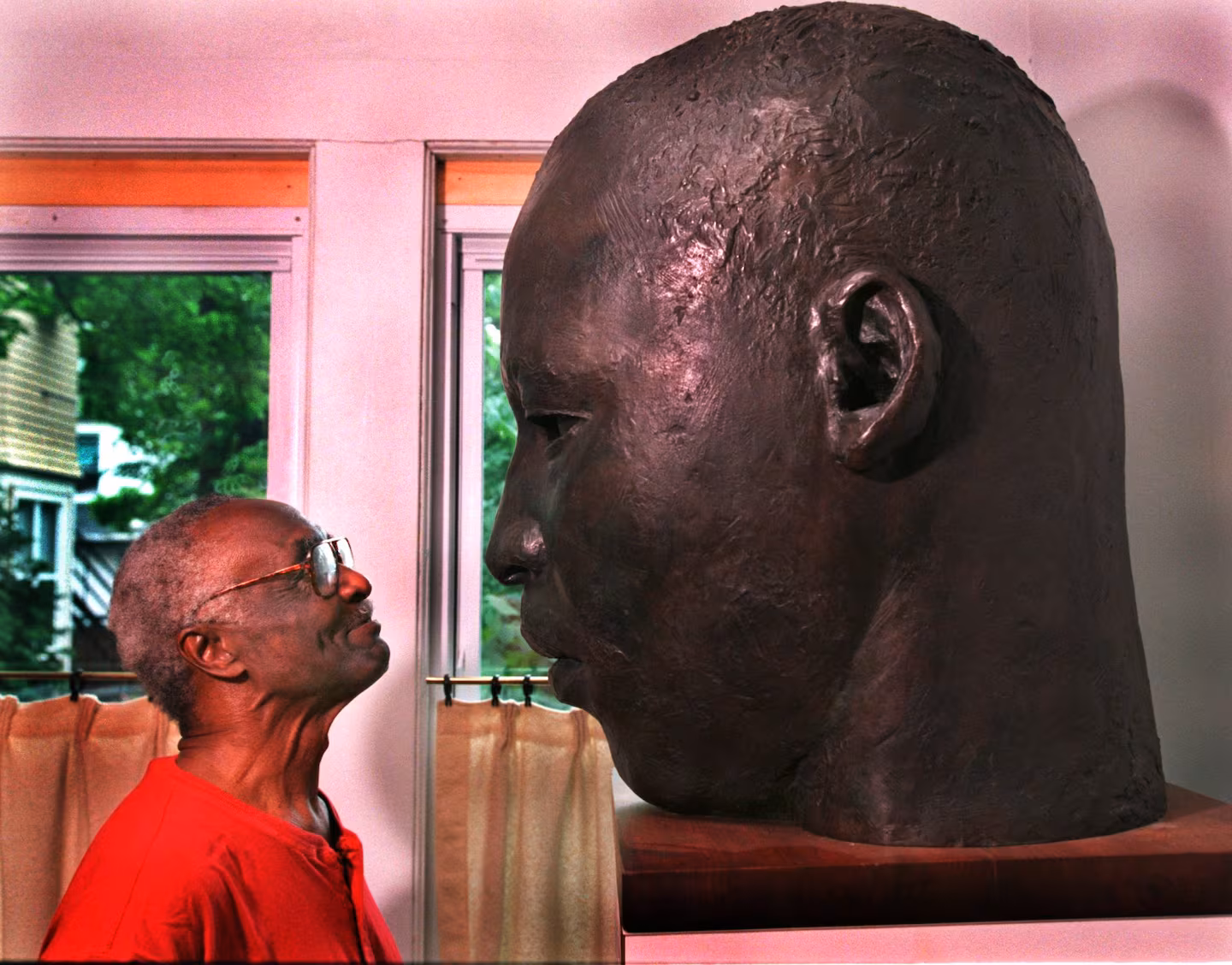 John Wilson shown in his Brookline home with a maquette for his statue of Martin Luther King Jr. in Buffalo, N.Y. CHIN, BARRY GLOBE STAFF PHOTO