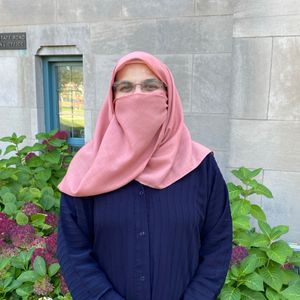 Naureen headshot in hijab, outside