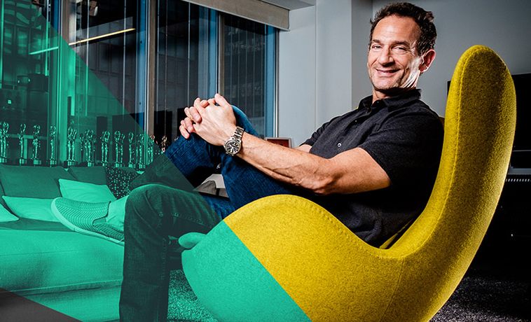 David Lubars reclining in a sleek office chair.