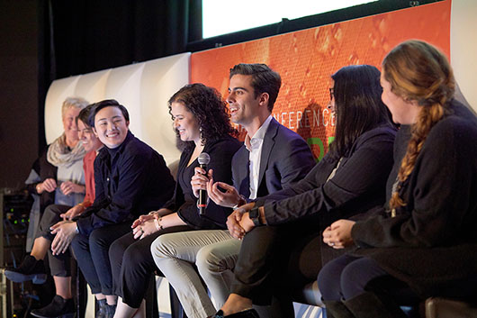 AdLab students speaking on panel at a conference.