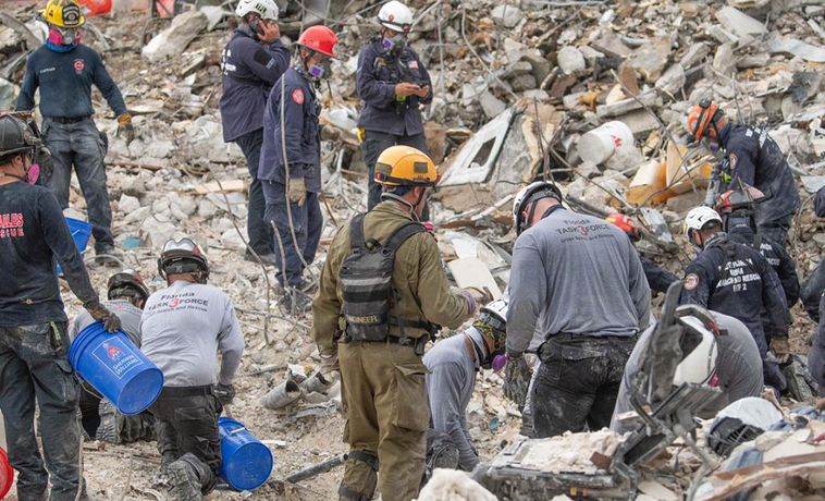 Crew at site of Surfside condo collapse working in the rubble.