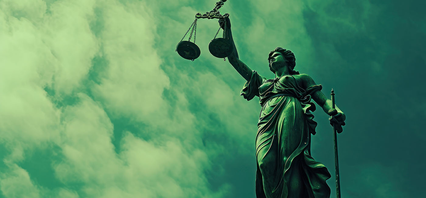 Illustration of lady justice holding a scale high in her left hand.