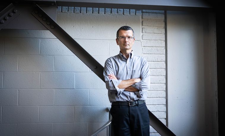 Steve Greenlee poses with his arms crossed.