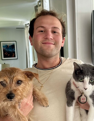 Portrait of James with a dog and cat
