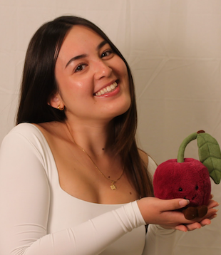 Sophia portrait holding a stuffed cherry