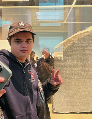 Alex taking a selfie with a peace sign