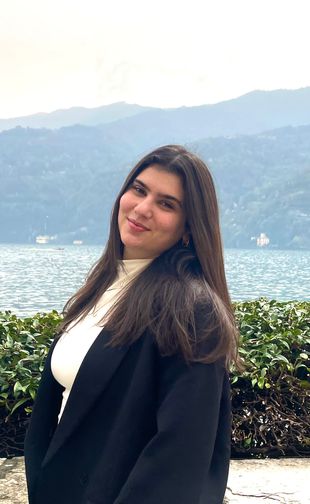 Portrait in blazer with mountainous background
