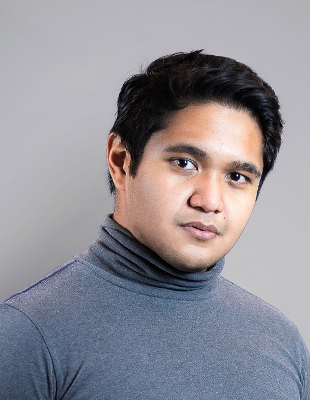 Professional headshot with gray background