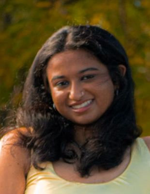 Smiling portrait in yellow tank top