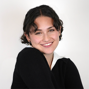 Smiling headshot with gray background