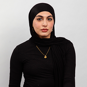 Serious headshot with gray background