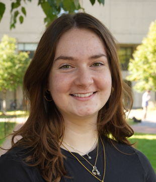 Smiling portrait outdoors with black shirt